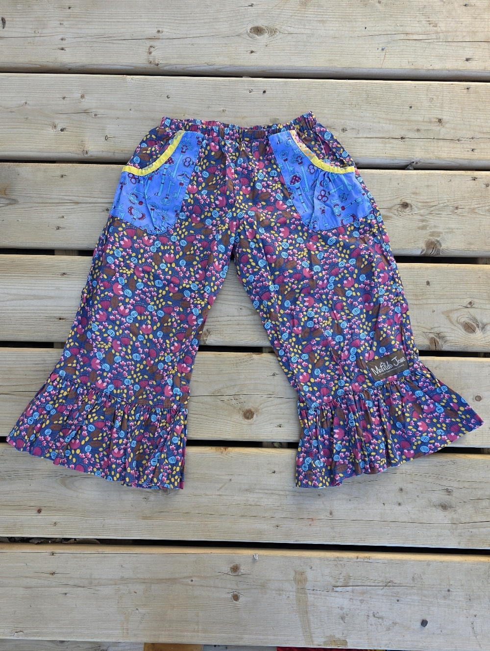 Matilda Jane Purple Floral Ruffle Pants with Blue Patch Pockets and Yellow Trim